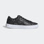 Adidas Originals Sleek Women's trainers in white, side profile showing the all-over black monogram Trefoil logo print on the leather upper.