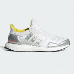 Adidas Ultraboost DNA x Lego Men's trainers in footwear white and shock blue, side profile showing the Primeknit upper, Boost midsole, and the Lego stud detail on the Three-Stripes cage.