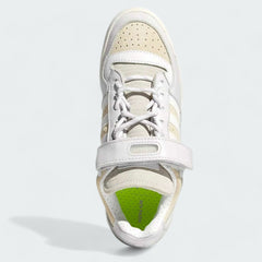 Top-down view of a pair of Adidas x Ivy Park Forum Low women's trainers in white, highlighting the lace-up closure and adjustable ankle strap.