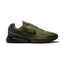 Studio side-profile shot of the Nike Air Max Phoenix men's trainers in Medium Olive and Sequoia, highlighting the earthy olive upper, textured side overlays, dark swoosh branding, and black tinted Max Air heel unit.