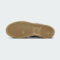 View of the outsole of the Nike Court Vision Low Men's blue shoes, showing the durable rubber sole and pivot circle traction pattern.