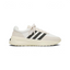 Side Profile Image: The Cream White L.A. Trainer, highlighting the iconic wavy midsole and the subtle tonal Three Stripes.