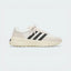 Side Profile Image: The Cream White L.A. Trainer, highlighting the iconic wavy midsole and the subtle tonal Three Stripes.