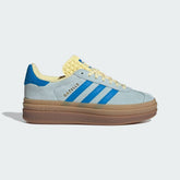 The Almost Blue Gazelle Bold, highlighting the unique triple-stacked white platform sole and the vibrant Bright Blue stripes.