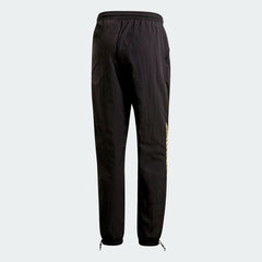 Adidas Tolima 02 Men's Track Pants in black nylon, back view showcasing the plain design and the fit.