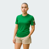 Person wearing a green t-shirt with a colorful sleeve design on a plain background