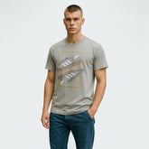 Man wearing a gray t-shirt with a graphic design on a white background