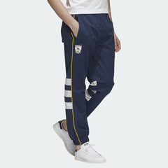 Adidas Arsenal 91-93 Track Pants Men's in collegiate navy, front view showing elastic waistband, red 3-Stripes down the legs, and embroidered Arsenal FC crest.