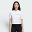 Highlights the high-velocity sweep of the shortened waistline hem, showing the professional, clean drape of the white cotton fabric and the loose, comfortable hang of the short sleeves.
