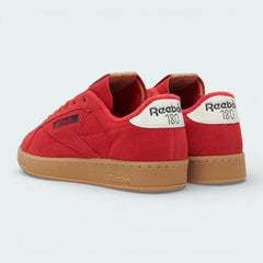 Rear view focusing on the Glen Green heel tab with printed Reebok branding and the clean stitching of the red