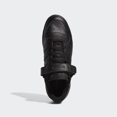 Top-down view of a pair of Adidas Forum Low Men's trainers in black, highlighting the lace-up closure and adjustable ankle strap.