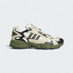 Adidas x Ivy Park Savage V4 men's sneakers in core white, wild pine green, and night indigo blue, side profile showing layered upper and Adidas 3-Stripes.