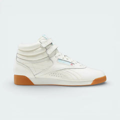 Side profile of the Reebok Freestyle Hi 40th Anniversary in Chalk ivory leather, showing the dual ankle straps and Digital Blue branding.