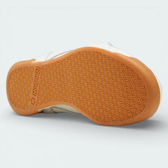 View of the gum rubber outsole, showcasing the classic traction pattern and the flexible pivot points.