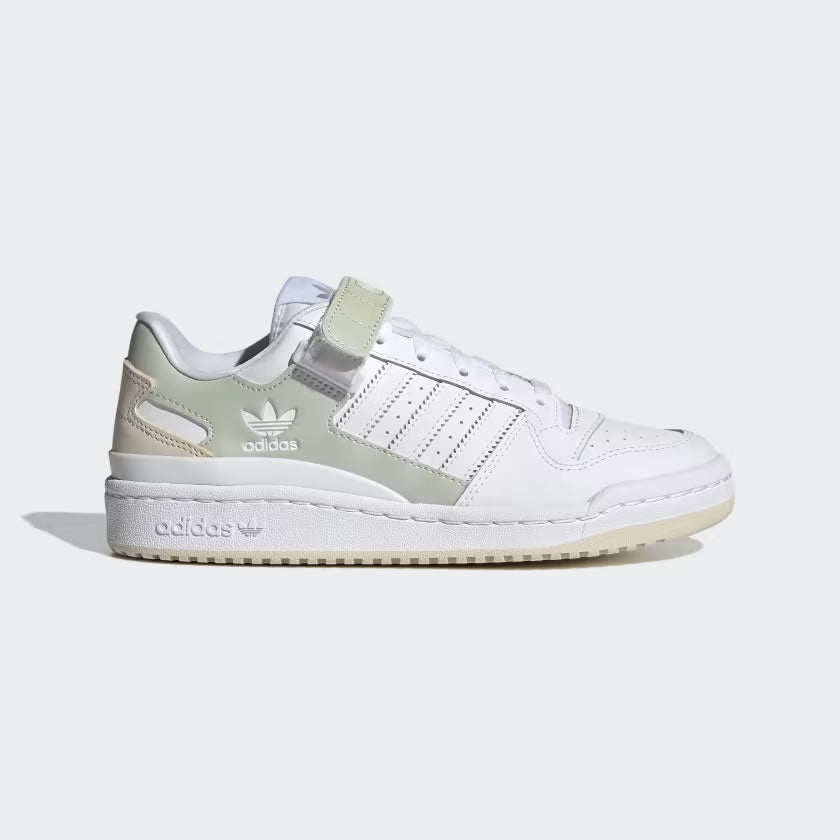 Adidas Forum Low Women's trainers in cloud white, side profile showing leather upper, classic Three Stripes, and hook-and-loop ankle strap