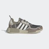 Adidas NMD_R1 women's shoes in bliss pink with cream white and light brown accents, side profile showing knit upper, white Boost midsole, and signature NMD plugs.