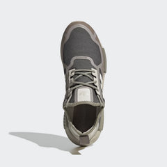 Top-down view of a pair of Adidas NMD_R1 women's shoes in bliss pink, highlighting the lace-up closure and soft knit texture.