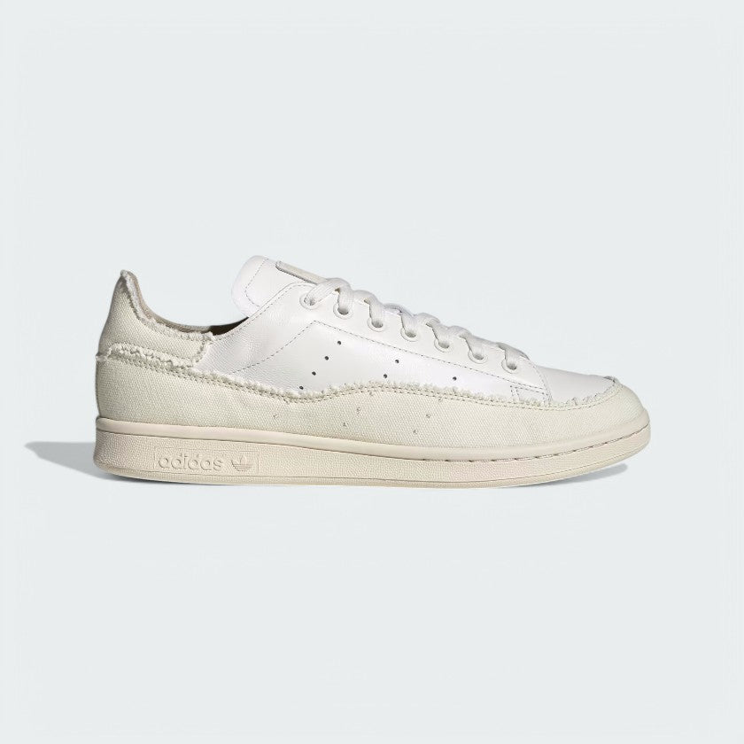 Adidas Stan Smith Recon Men's trainers in core white leather, side profile showing clean lines, perforated 3-Stripes, and classic silhouette.