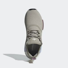Top-down view of a pair of Adidas NMD_R1 women's trainers in grey, highlighting the lace-up closure and soft knit texture.