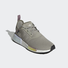 Angled view of Adidas NMD_R1 women's trainers in grey and white, side by side, showcasing their sleek, futuristic design.