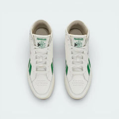 Top-down view of the off-white trainers, highlighting the clean leather toe box and the traditional lacing system extending up the ankle.