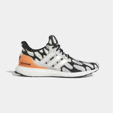 Adidas Ultraboost 1.0 x Marimekko running shoes in black with a white and coral print, side profile showing the Primeknit upper, white Boost midsole, and Continental™ rubber outsole.