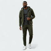 Nike NSW Optic Tracksuit in olive green, front view worn by a model showing the full-zip hoodie and matching tapered pants.