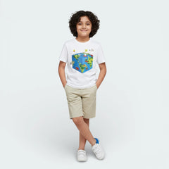 Child wearing a white t-shirt with a colorful graphic design on a plain background
