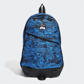 Adidas Adventure Backpack in blue and black, front view showing top zip closure, front zip pocket, and woven loops for attachments.