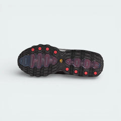 View of the rubber outsole of the Air Max DN8, showcasing the multi-surface traction pattern and the visible red Air chambers.