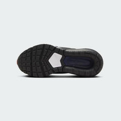 View of the outsole of the Nike Air Max Pulse Juniors' black trainers, showing the durable rubber waffle-inspired tread pattern.
