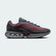 Nike Air Max DN Men's Black Trainers HM0708-002 side view showing streamlined black upper and dual-chamber Air unit in heel