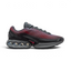 Nike Air Max DN Men's Black Trainers HM0708-002 side view showing streamlined black upper and dual-chamber Air unit in heel