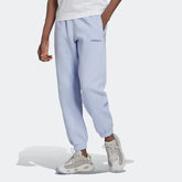 Adidas Trefoil Linear Men's Sweat Pants in violet, front view showing elastic waistband, drawcord, tapered legs, side pockets, and linear Trefoil branding down the leg.
