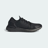 Adidas by Stella McCartney Ultra Boost 20 Women's trainers in black, side profile showing the Primeknit upper, chunky Boost midsole, and supportive cage.