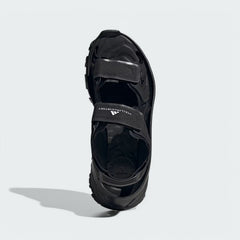 Top-down view of a pair of Adidas by Stella McCartney Hika Sandals in black, highlighting the multiple straps and footbed design.