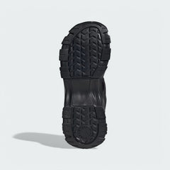 View of the outsole of the Adidas by Stella McCartney Hika Sandals in black, showing the durable tread pattern for grip.