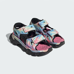 Angled view of two Adidas by Stella McCartney Hika Sandals in pink, yellow, and black, side by side, showcasing their robust yet stylish multi-colored design.