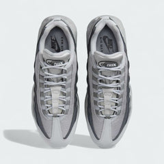Top-down view of a pair of Nike Air Max 95 Men's running shoes in grey, highlighting their iconic silhouette and lacing system.