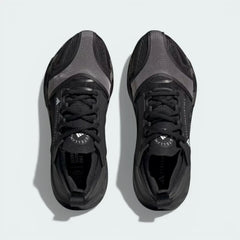 Top-down view of the running shoes, highlighting the engineered mesh inserts and the integrated Stella McCartney branding on