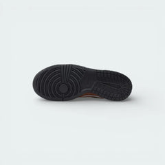 View of the black rubber outsole, showcasing the iconic hoops pivot circle and traction pattern designed for maximum grip.