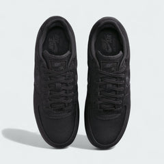 Top-down view of a pair of Nike Air Force 1 Low Canvas Men's trainers in black, highlighting their classic silhouette and lace-up closure.