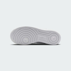 View of the outsole of the Nike Air Force 1 Low Juniors' white/sand trainers, showing the durable rubber sole with pivot circles for traction.