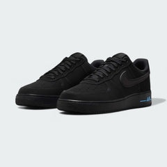 Angled view of two Nike Air Force 1 '07 Men's black trainers with blue accents, side by side, showcasing their timeless design and clean aesthetic.