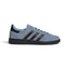 Displays the full lateral silhouette featuring the rich Tactile Blue suede upper, contrasting Core Black serrated 3-Stripes, gleaming metallic gold foil "SPEZIAL" lettering, matching black heel patch, and the solid low-profile dark rubber cupsole.