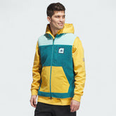 Adidas Adicross Padded Fleece Gilet Men's in emerald green, front view showing the full-zip closure, quilted padded body, fleece side panels, and Adidas logo.