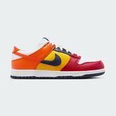 Nike Dunk Low CO.JP 'What The' QS men's shoes, side profile showcasing the mismatched multi-colour panels in navy, yellow, red, and blue with a white midsole.