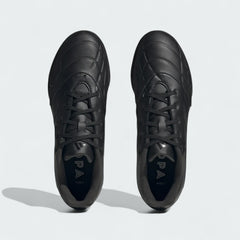 Top-down view of a pair of Adidas Copa Pure.3 Turf Men's football boots in black, highlighting their classic silhouette and lace-up closure.