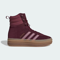 The Maroon Gazelle, highlighting the Wonder Orchid 3-Stripes and the gleaming Gold Metallic wordmark.
