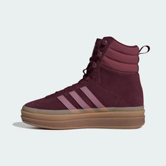 Maroon high-top sneaker with three stripes on a light gray background